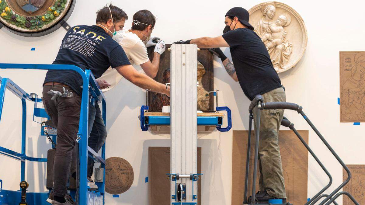North Carolina Museum of Art Chief Art Handler Ian Larson, left, works with his team in the European Gallery on Tuesday, August 2, 2022 in Raleigh, N.C. The museum is undergoing a reinstallation of their collection and is set for a re-opening in October 2022.