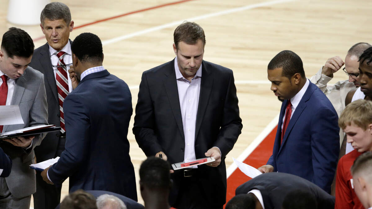 Nebraska coach Fred Hoiberg prepares to speak to his players during a time out during a game against UC Riverside in Lincoln, Neb., Nov. 5, 2019. Bobby Lutz, special assistant to the head coach, is to the left.