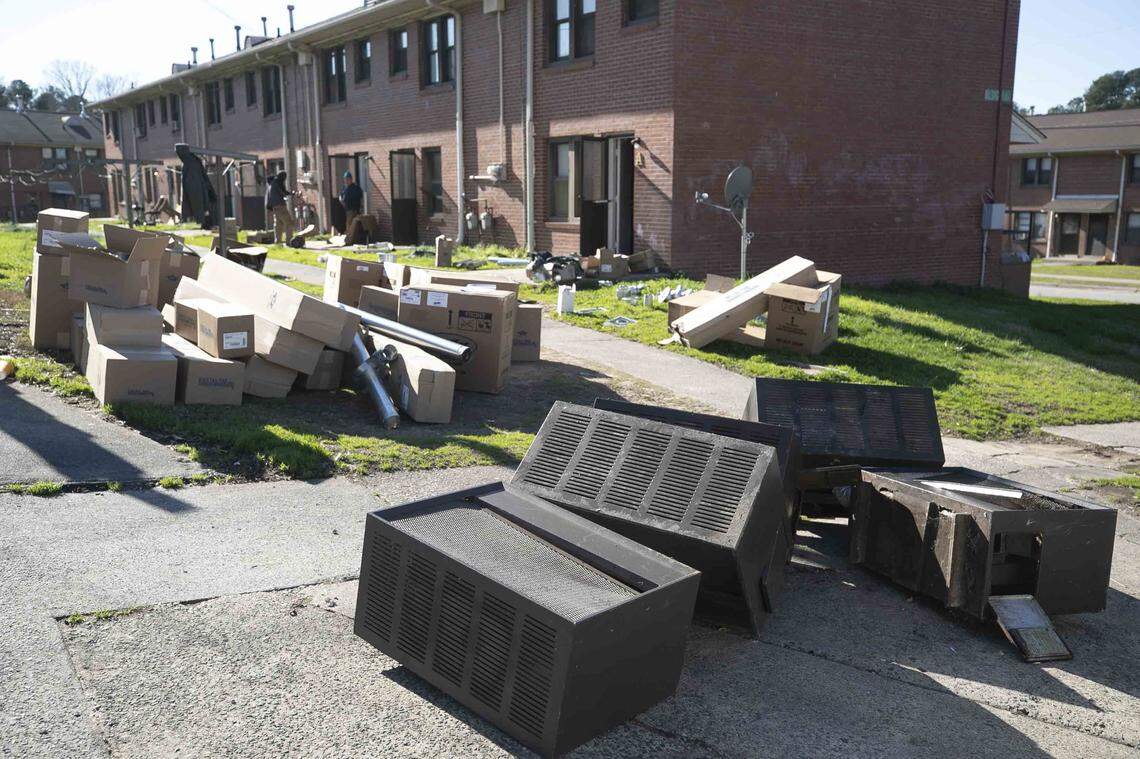 Discarded heating units are placed at the curb on Friday, February 14, 2020 at McDougald Terrace in Durham, N.C. as renovations at the Durham Housing complex continue. Eight families were notified on Friday that they could move back into their renovated units.