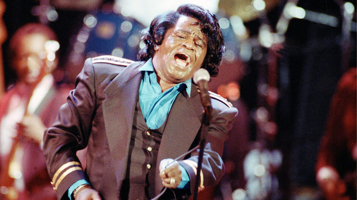 In a file photo James Brown sings “Living in America” during his three-hour concert at the Wiltern Theater in Los Angeles, Ca., on June 10, 1991.