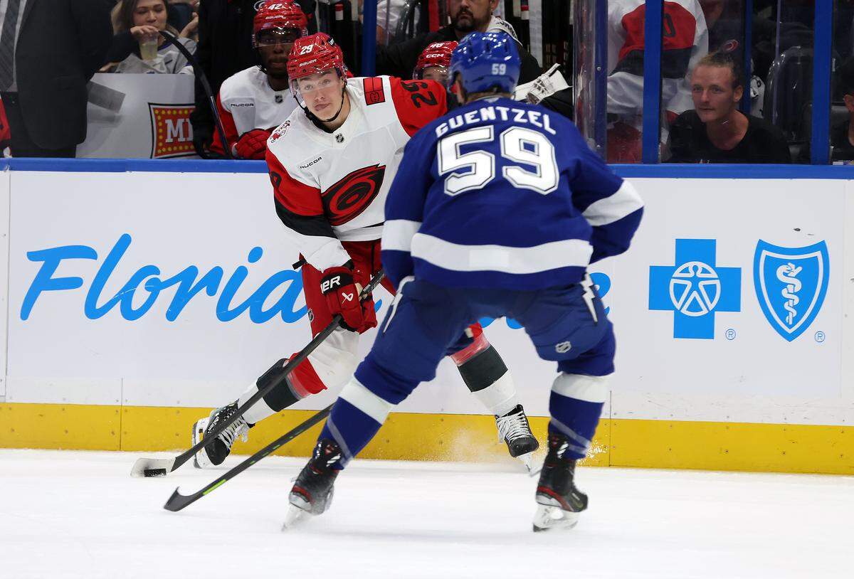 Carolina Hurricanes left wing Bradly Nadeau (29) passes the puck as Tampa Bay Lightning center Jake Guentzel (59) defends during the second period at Benchmark International Arena. 
