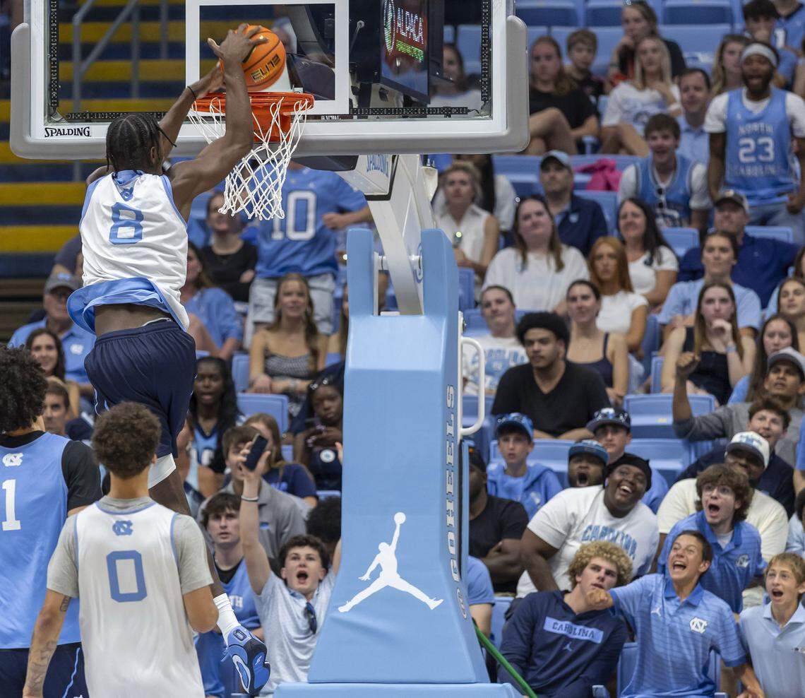 Much to the delight of fans, North Carolina forward Caleb Wilson (8) soars above the rim for a dunk, however the ball rimmed out, during the Blue-White scrimmage on Saturday, October 4, 2025 at the Smith Center in Chapel Hill, N.C.