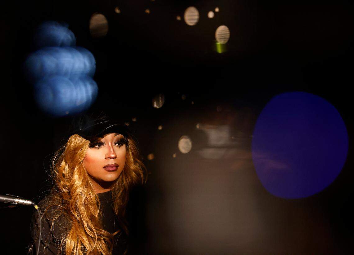 Drag artist Naomi Dix listens during a press conference held at the Pinhook on Thursday, Dec. 8, 2022, in Durham, N.C. regarding the Dec. 3rd drag performance at Sunrise Theater in Southern Pines, N.C. and the power outage in Moore County.