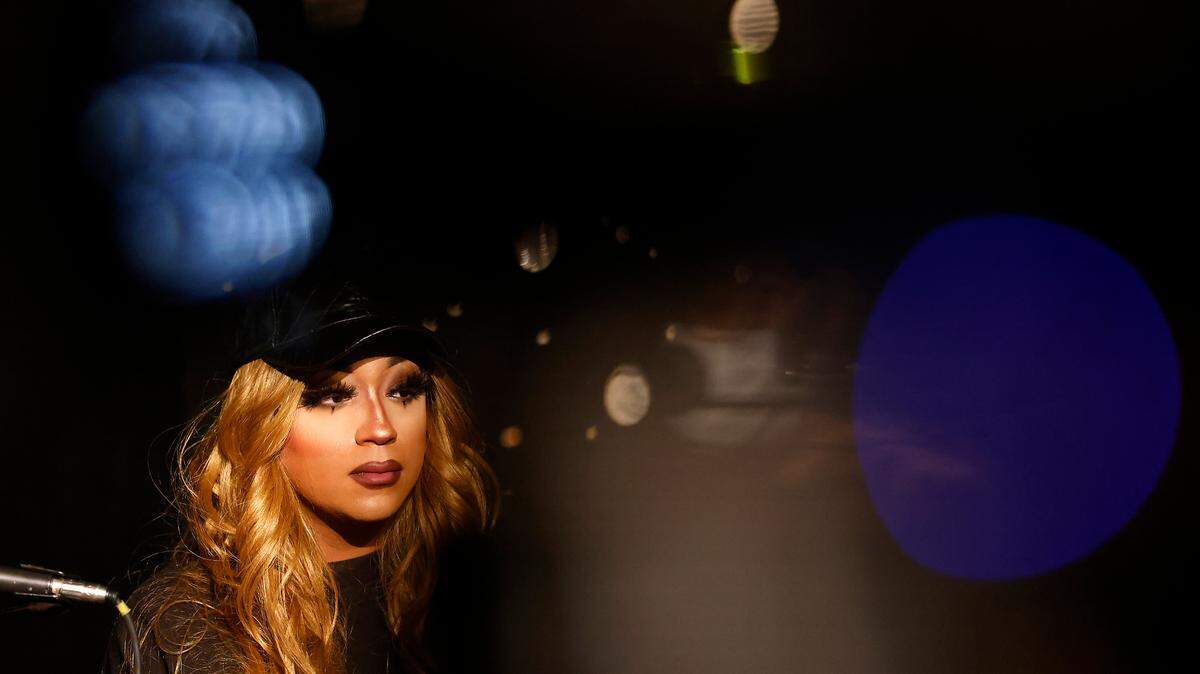 Drag artist Naomi Dix listens during a press conference held at the Pinhook on Thursday, Dec. 8, 2022, in Durham, N.C. regarding the Dec. 3rd drag performance at Sunrise Theater in Southern Pines, N.C. and the power outage in Moore County.