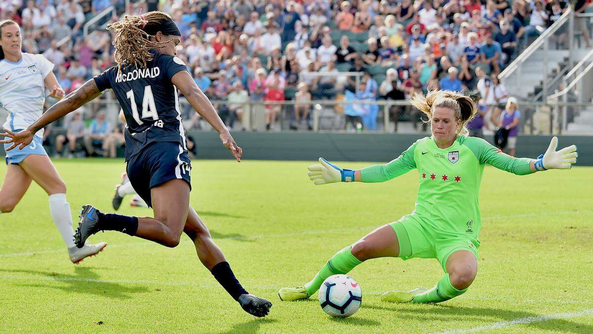 North Carolina Courage’s Jessica McDonald (14) attempts a shot on goal against Red Stars’ goalkeeper Alyssa Naeher (1) during the first half. The North Carolina Courage and the Chicago Red Stars met in the 2019 National Women’s Soccer League Championship Finals in WakeMed Soccer Park in Cary, N.C. on October 27, 2019. Courage wins 4-0.