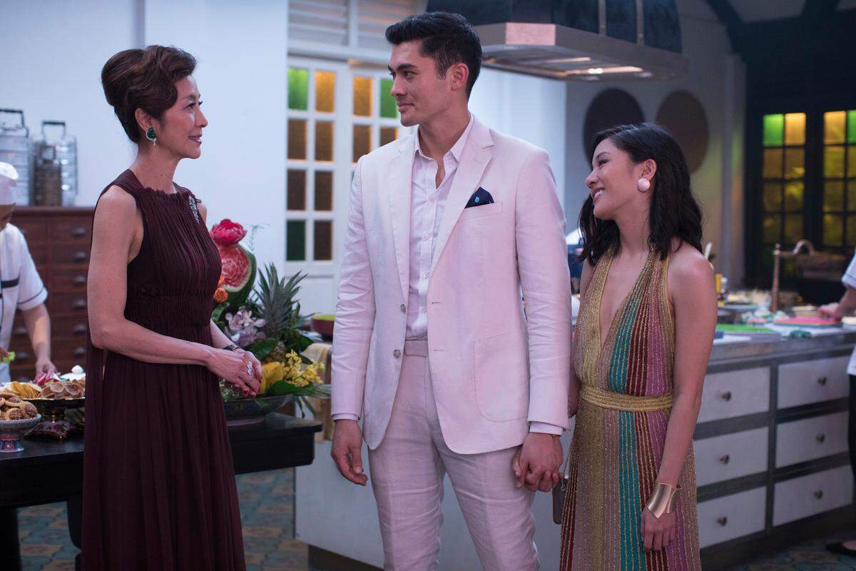 Michelle Yeoh, from left, Henry Golding and Constance Wu in a scene from the film “Crazy Rich Asians.” 