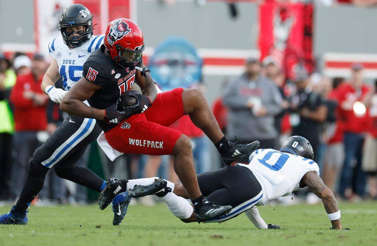 \N.C. State tight end Justin Joly (15) pulls in a reception while defended by Duke cornerback Chandler Rivers (0) during the first half of N.C. State’s game against Duke at Carter-Finley Stadium in Raleigh, N.C., Sat. Nov. 9, 2024.