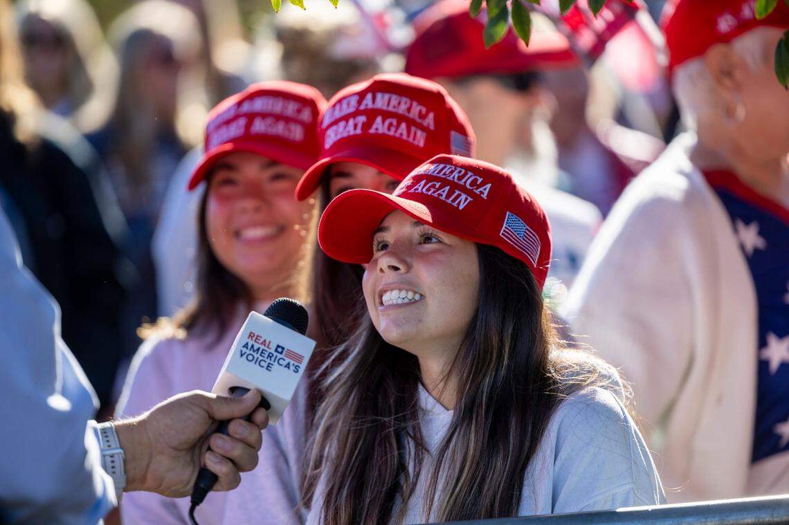 Supporters of former President Donald Trump are interviewed outside Minges Coliseum in Greenville prior to a rally on Monday, Oct. 21, 2024. With two weeks until Election Day, Trump went on a three-city tour, in which Trump will also see the destruction caused by Hurricane Helene in Asheville and speak at a faith conference in Concord.