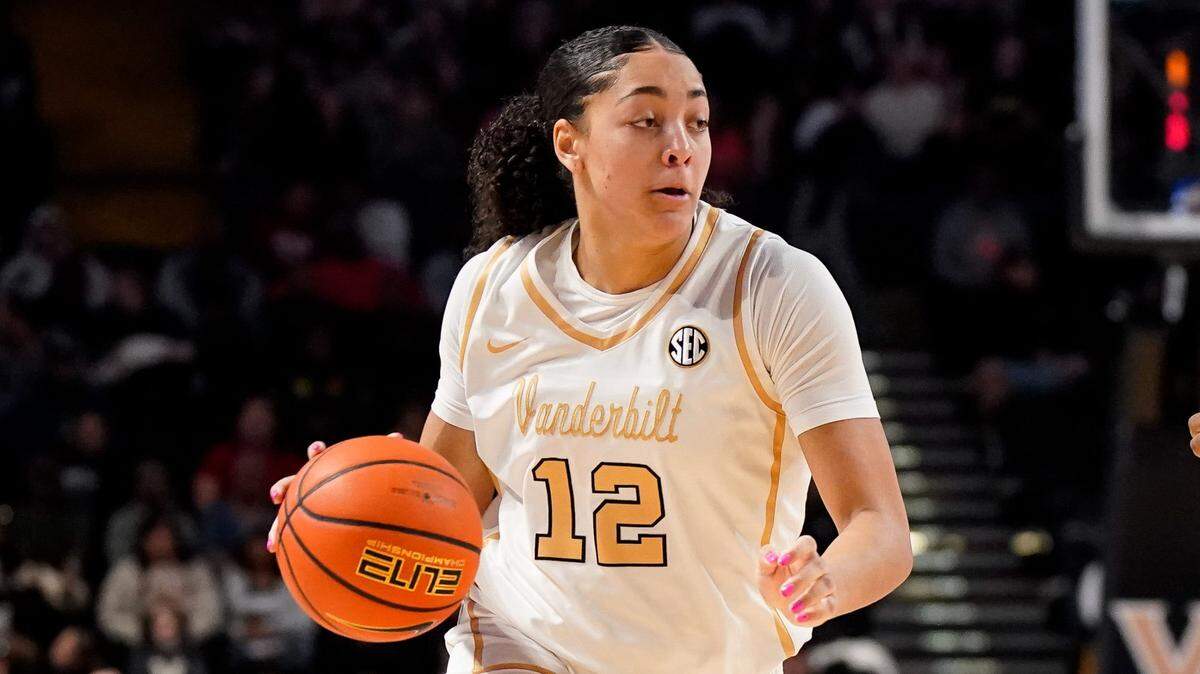 Vanderbilt forward Khamil Pierre (12) bolts past South Carolina guard Raven Johnson (25) during the second quarter at Memorial Gym in Nashville, Tenn., Sunday, Feb. 23, 2025.