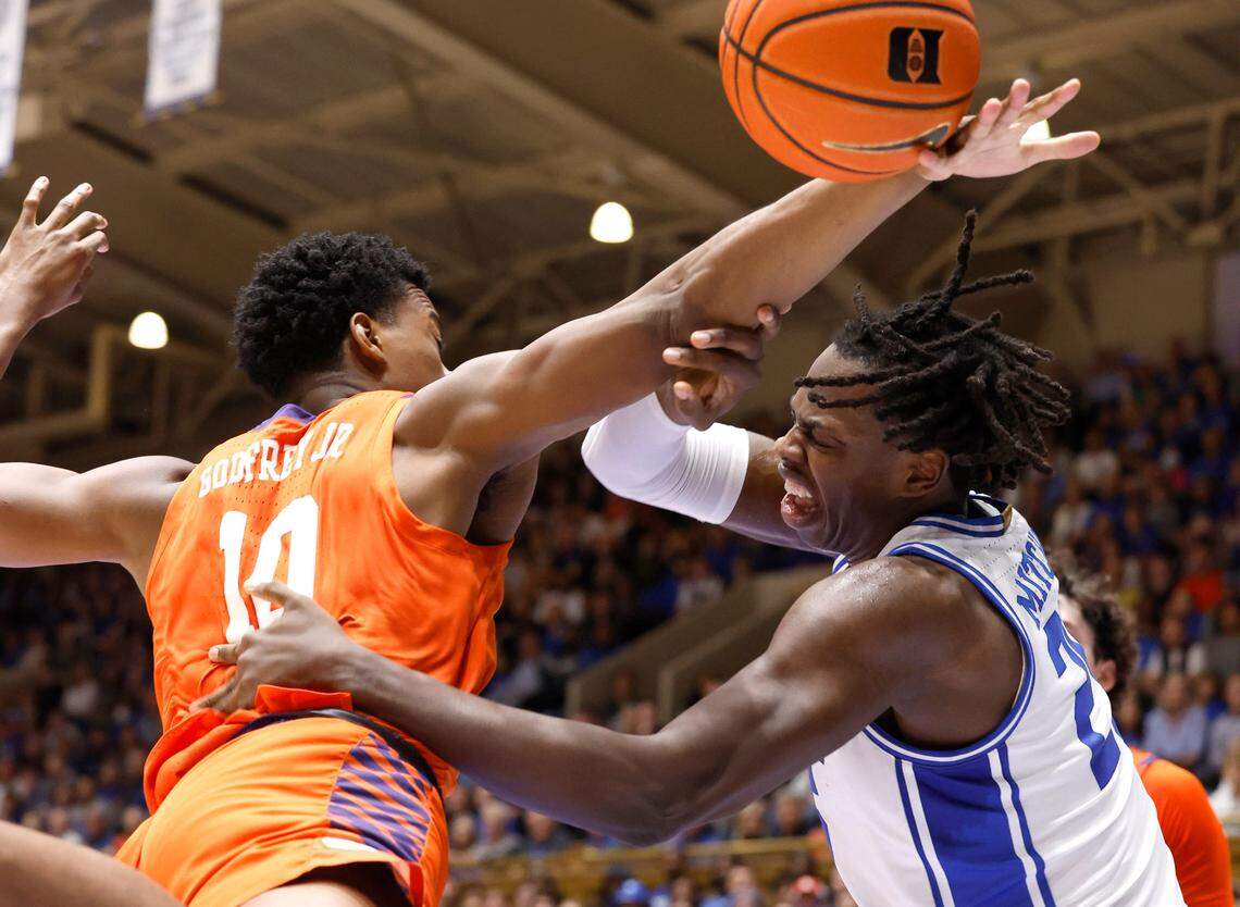 Duke’s Mark Mitchell (25) and Clemson’s RJ Godfrey (10) go after the ball during the first half of Duke’s game against Clemson at Cameron Indoor Stadium in Durham, N.C., Saturday, Jan. 27, 2024.