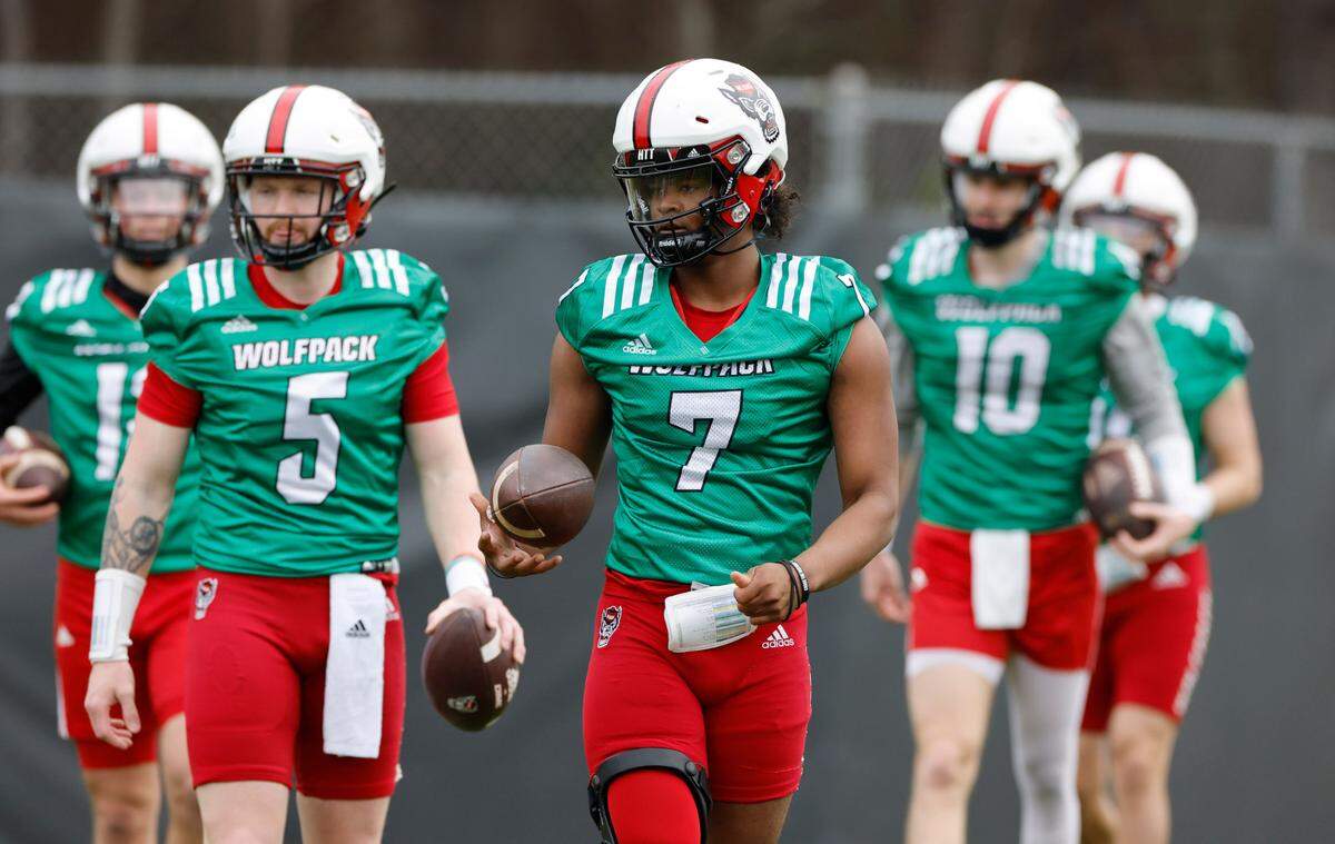 N.C. State quarterback MJ Morris (7) leads the quarterback group during the Wolfpack’s first spring practice in Raleigh, N.C., Wednesday, March 1, 2023.