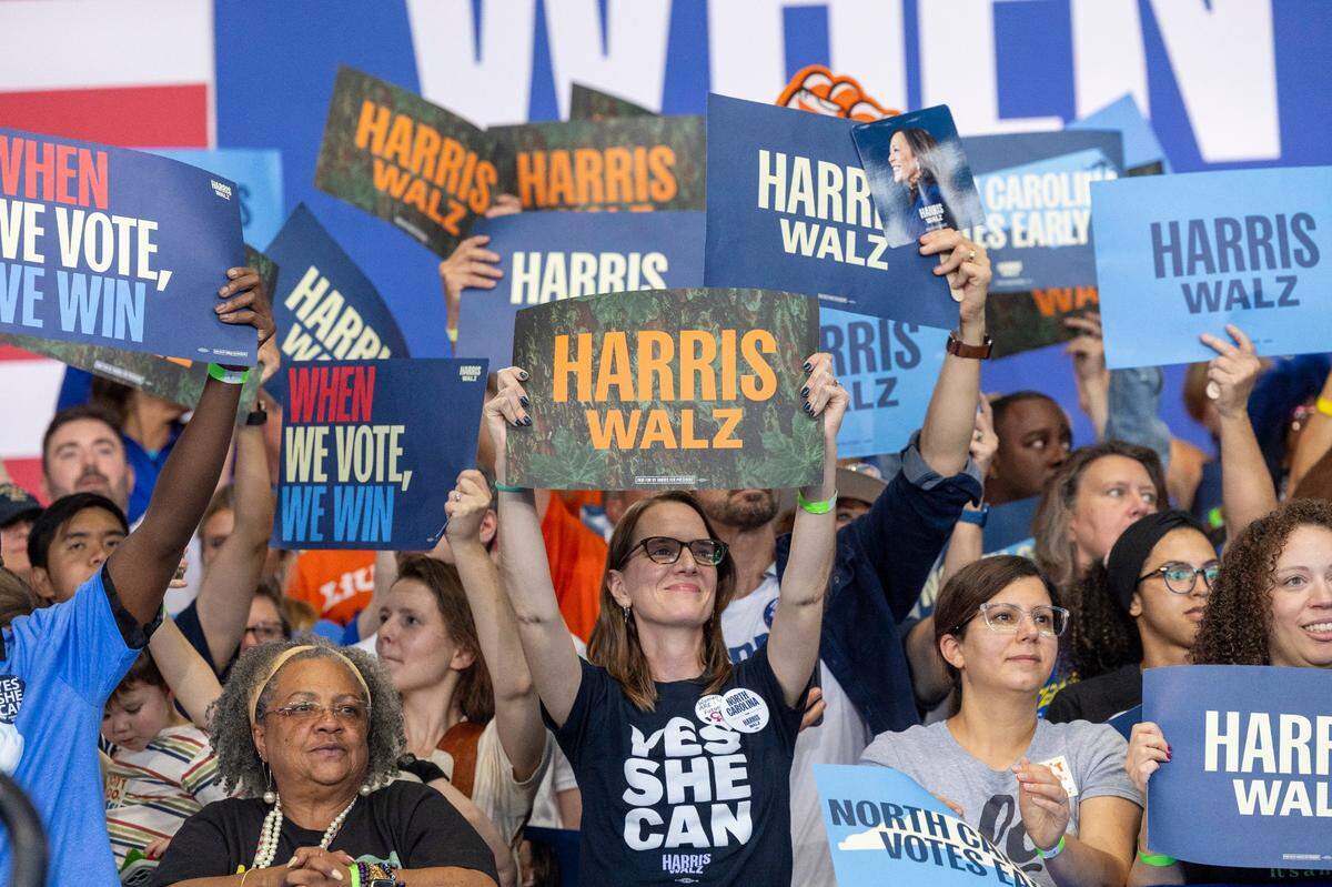 Supporters cheer on Vice President Kamala Harris as she speaks speaks during a rally at Coastal Credit Union Music Park at Walnut Creek in Raleigh on Wednesday, Oct. 30, 2024.