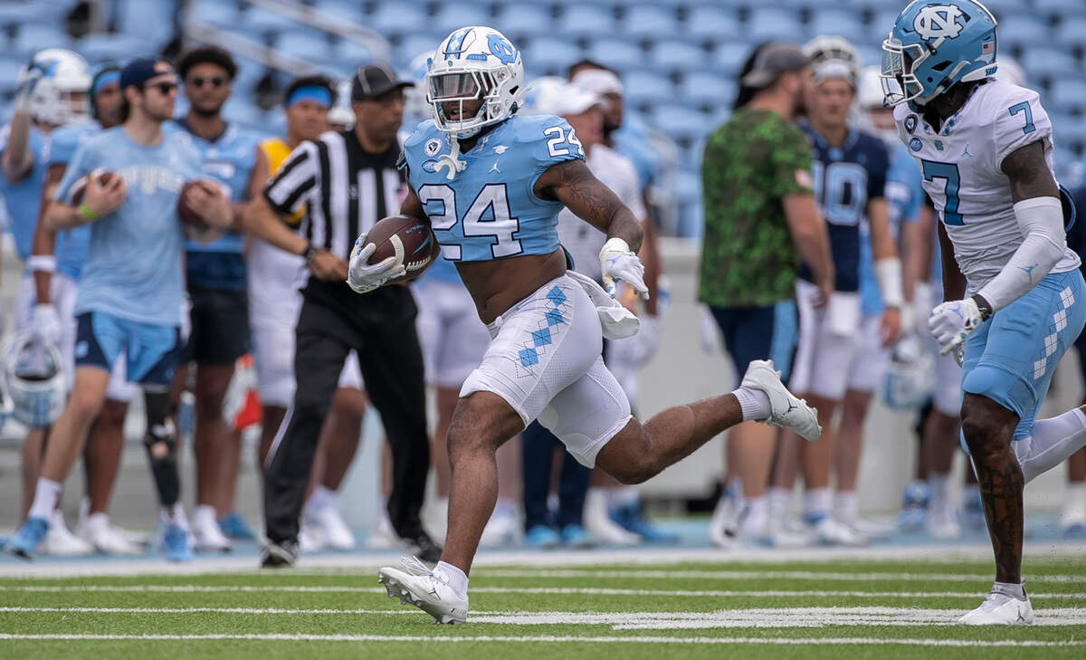 North Carolina running back British Brooks (24) breaks open for a long run during the Tar Heels’ spring football game on Saturday, April 15, 2023 at Kenan Stadium in Chapel Hill, N.C.