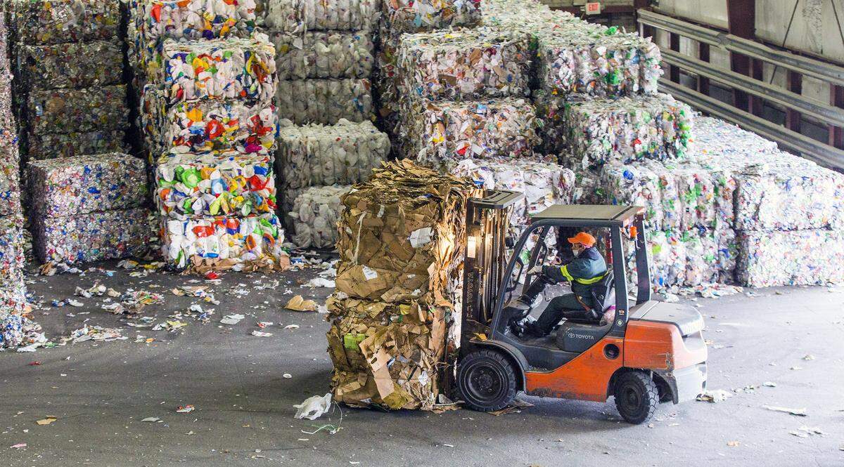 Bales of cardboard are loaded onto trucks at the Sonoco Recycling facility on Wednesday, Mar. 7, 2018, in Raleigh, NC. Sonoco is one of many materials recovery facilities (MRFs) in the state affected by China’s new strict standards for mixed paper recycling, nearly eliminating the biggest importer of recyclables. This is driving down prices and increasing standards of quality amongst the remaining importers.