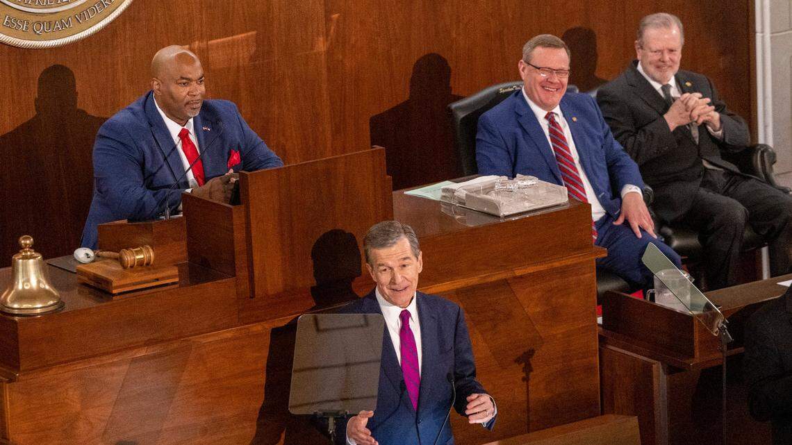 Gov. Roy Cooper delivers his State of the State address to a joint session of the N.C. General Assembly on Monday, March 6, 2023 as, from left, Lt. Gov. Mark Robinson, House Speaker Tim Moore and Senate Leader Phil Berger look on.