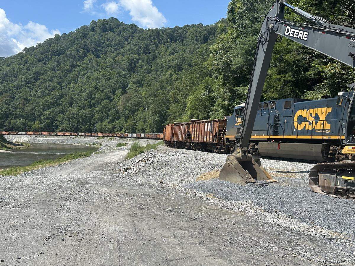 A CSX train loaded with stone near the confluence of the Cane and North Toe rivers in Western North Carolina, on Aug. 14, 2025. The rivers form the Nolichucky River, where flooding from the remnants of Hurricane Helene washed away miles of track and railbed.