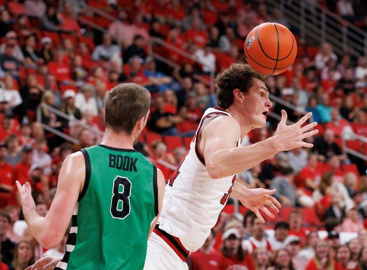 N.C. State’s Ben Middlebrooks forces a USC Upstate turnover during the first half of the Wolfpack’s game on Monday, Nov. 4, 2024, at the Lenovo Center in Raleigh, N.C.