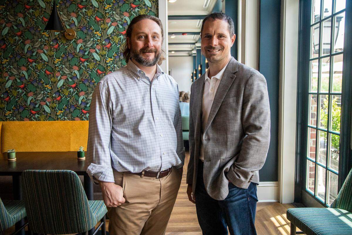 Craig Spitzer, left, and Craig Shipley, co-founders the hospitality firm Early Bird Night Owl, operate the Cary hotel and rebranded it as The Mayton.