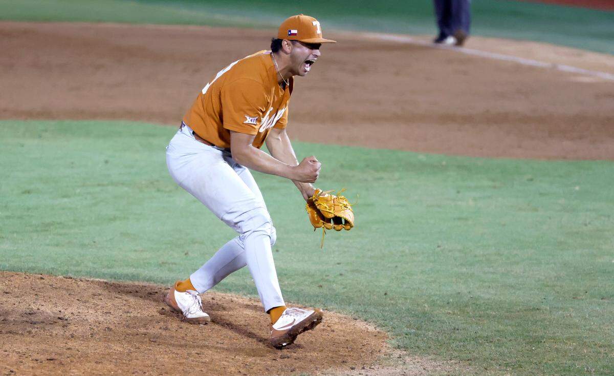 Texas’ Jared Southard (49) celebrates after the last out giving Texas the 11-1 victory over ECU to win the Greenville Super Regional at Clark-LeClair Stadium early Monday morning, June 13, 2022.