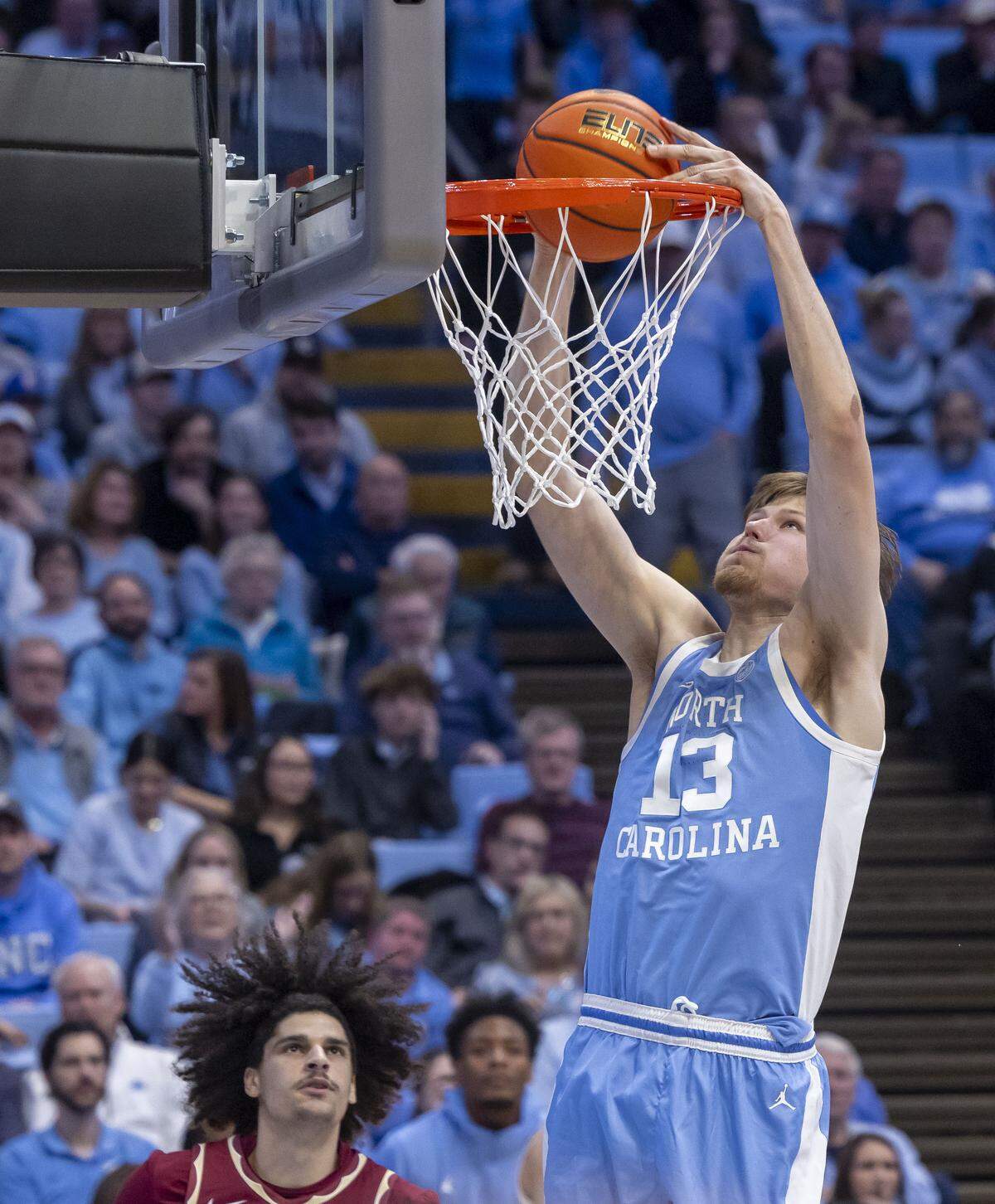 North Carolina center Henri Veesaar (13) gets a dunk in the second half against Florida State on Tuesday, December 30, 2025 at the Smith Center in Chapel Hill, N.C. Veesaar scored 12 points and collected 12 rebounds in the Tar Heels’ victory. 