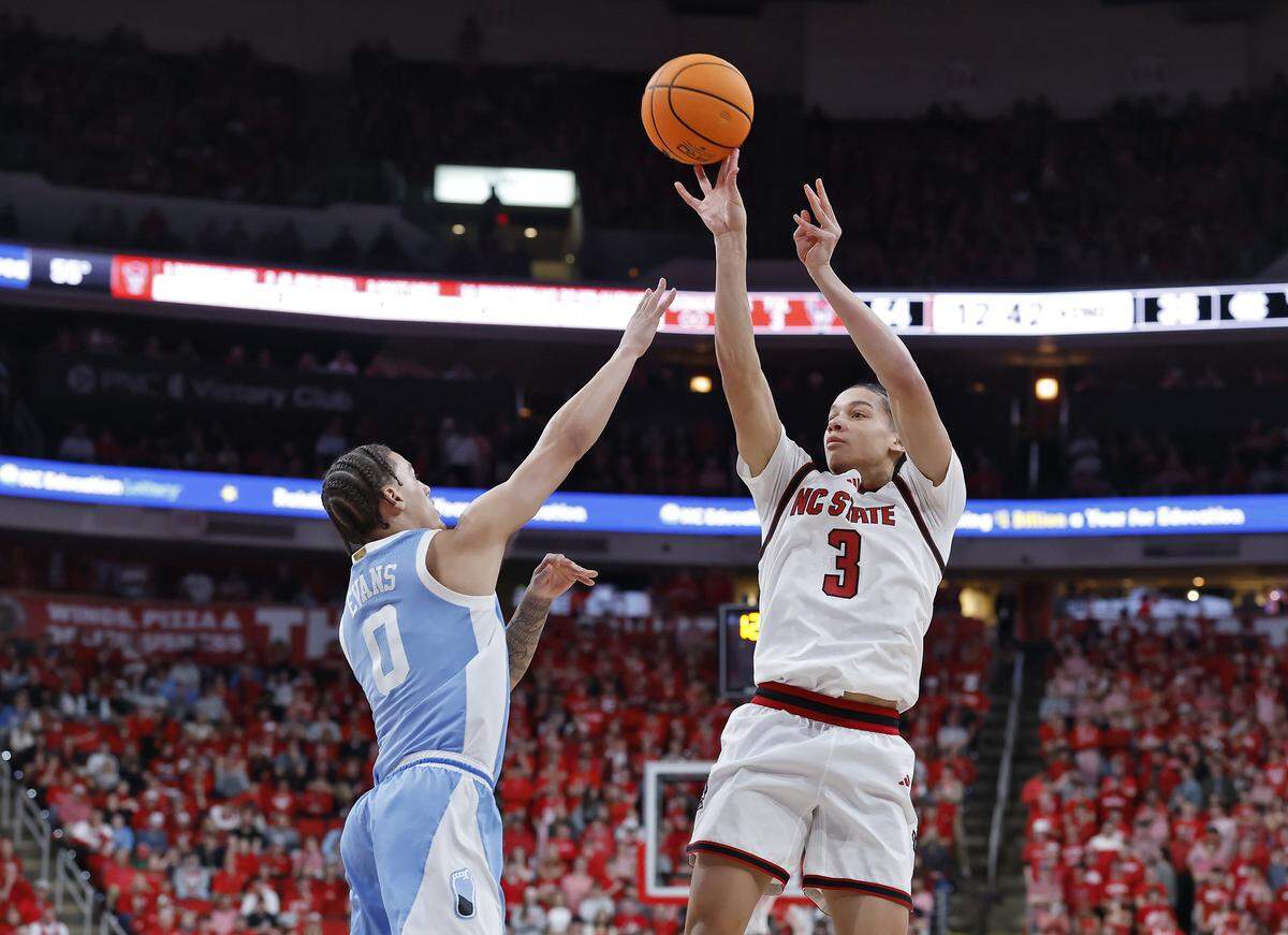 N.C. State’s Matt Able shoots over North Carolina’s Kyan Evans during the second half of the Wolfpack’s 82-58 win  on Tuesday, Feb. 17, 2026, at Lenovo Center in Raleigh, N.C. 