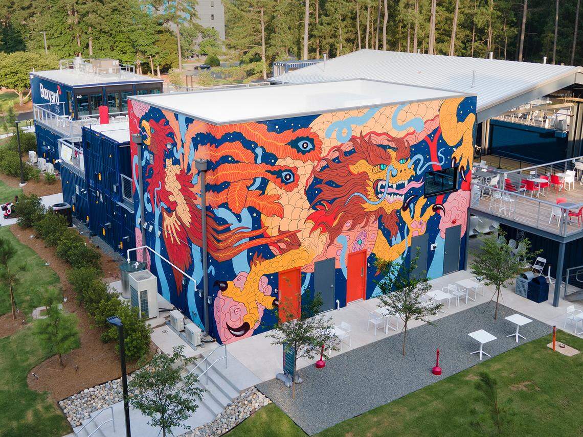 Durham-based artist Gabriel Eng-Goetz painted a mural at Boxyard RTP, a collection of shipping containers in Hub RTP that are home to restaurants and drinks spots.
