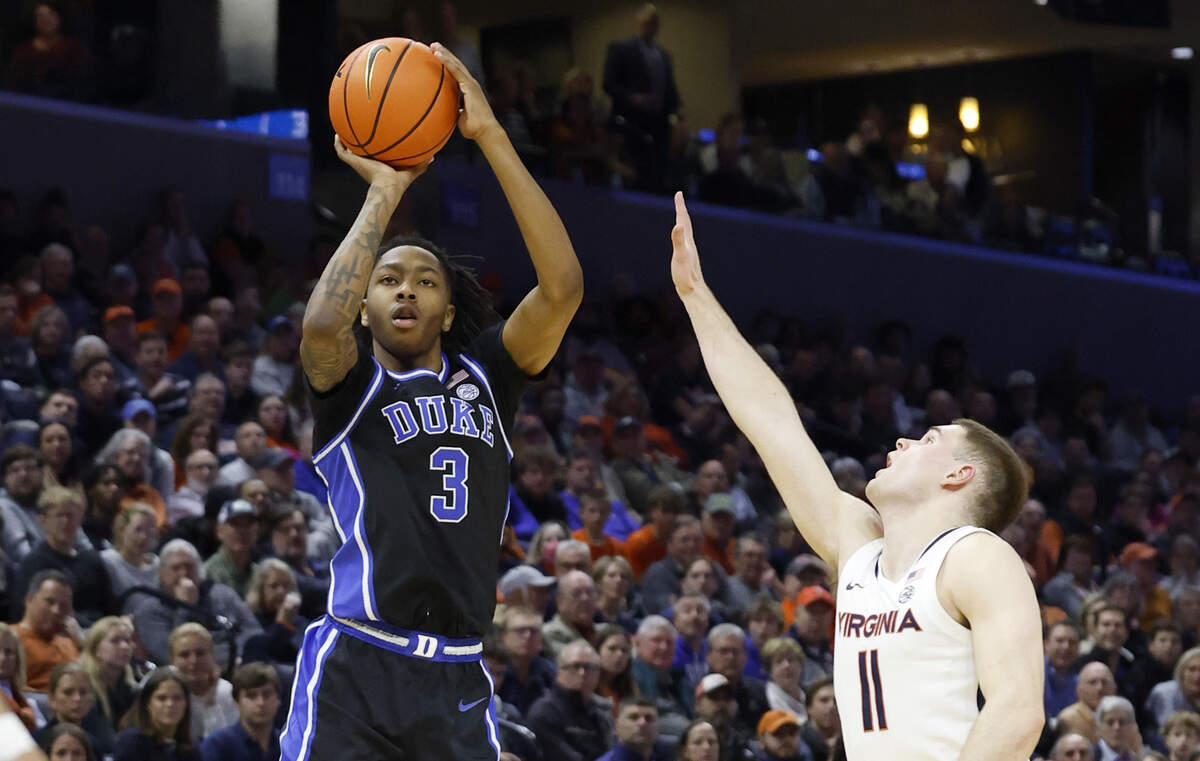 Duke’s Isaiah Evans (3) hits a three-pointer during the first half of Duke’s game against Virginia at John Paul Jones Arena in Charlottesville, Va., Monday, Feb. 17, 2025.