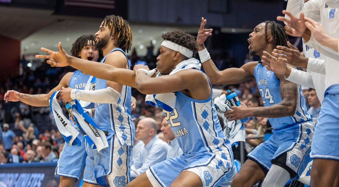 North Carolina forward Ven-Allen Lubin (22) leads the cheers on the Tar Heels bench after a three-point basket by Ian Jackson (11) in the second half against San Diego State during the NCAA First Four on Tuesday, March 18, 2025 at the University of Dayton Arena in Dayton, Ohio.