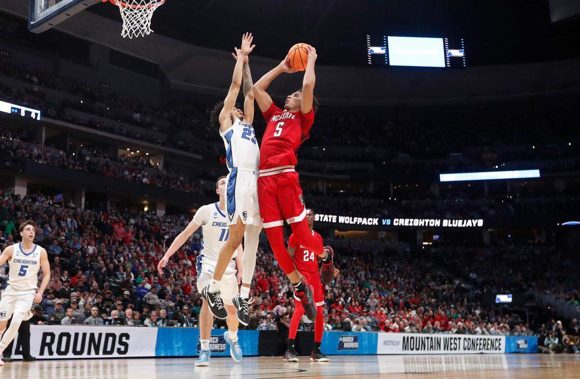N.C. State’s Jack Clark (5) shoots as Creighton’s Trey Alexander (23) defends during Creighton’s 72-63 victory over N.C. State in the first round of the NCAA Tournament at Ball Arena in Denver, Colo., Friday, March 17, 2023.