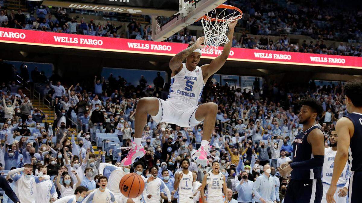 North Carolina forward Armando Bacot (5) goes in for a dunk against Virginia during the second half of an NCAA college basketball game Saturday, Jan. 8, 2022, in Chapel Hill, N.C. (Photo/Chris Seward)