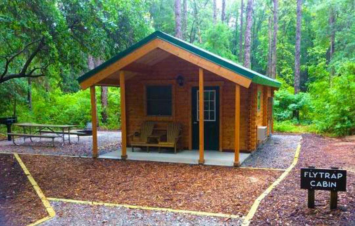 Carolina Beach State Park campground has six cabins visitors can rent. How glamorous they are depends on what accoutrements campers bring along for their stay.