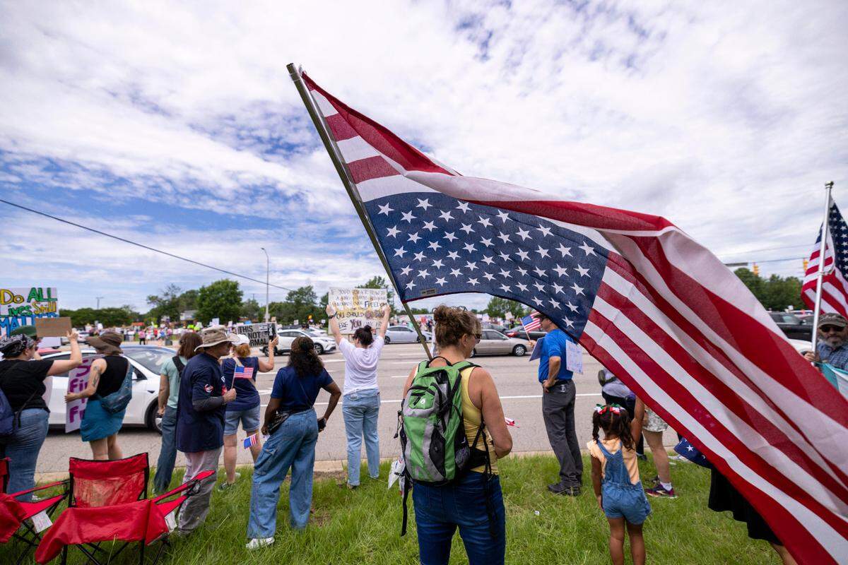 More than 1500 demonstrators lined Capital Boulevard to protest the policies and tactics of the of President Donald Trump on Saturday, June 14, 2025 near Triangle Town Center in Raleigh. The Raleigh “No Kings” rally was one of dozens across North Carolina and hundreds nationwide on what organizers called a nationwide day of defiance against the Trump administration.