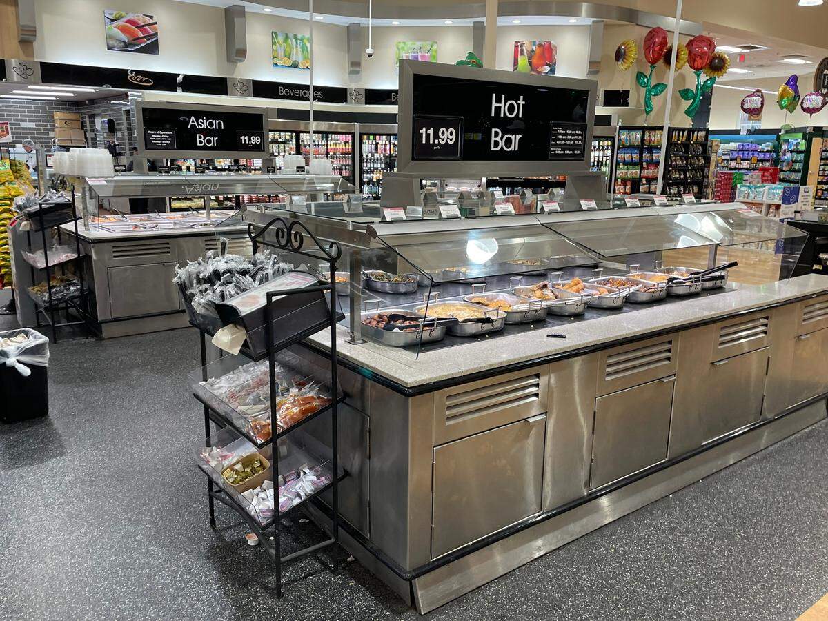 The Harris Teeter in Raleigh’s Village District offers customers an Asian and traditional hot bar.