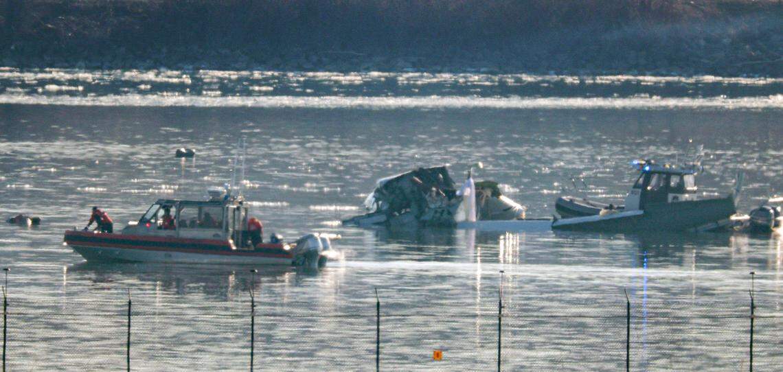 Emergency response units search the crash site of an American Airlines plane on the Potomac River after an accident last night while on approach to Reagan National Airport on Jan. 30, 2025, in Arlington, Virginia. The American Airlines flight from Wichita, Kansas collided midair with a military Black Hawk helicopter while on approach to Ronald Reagan Washington National Airport. According to reports, there were no survivors among the 67 people on both aircraft.
