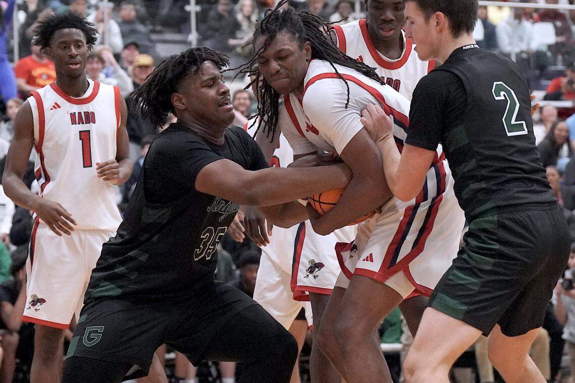 Greenfield's Braxten Dubose (35) battles with Coronado's  Amare Oba (4) for possession of the ball during the second half.  The Greenfield Knights and the Coronado Cougars (Nevada) met in the finals of the Day'Ron Sharpe bracket of the  John Wall Holiday Tournament in Raleigh, N.C. on December 30, 2025.