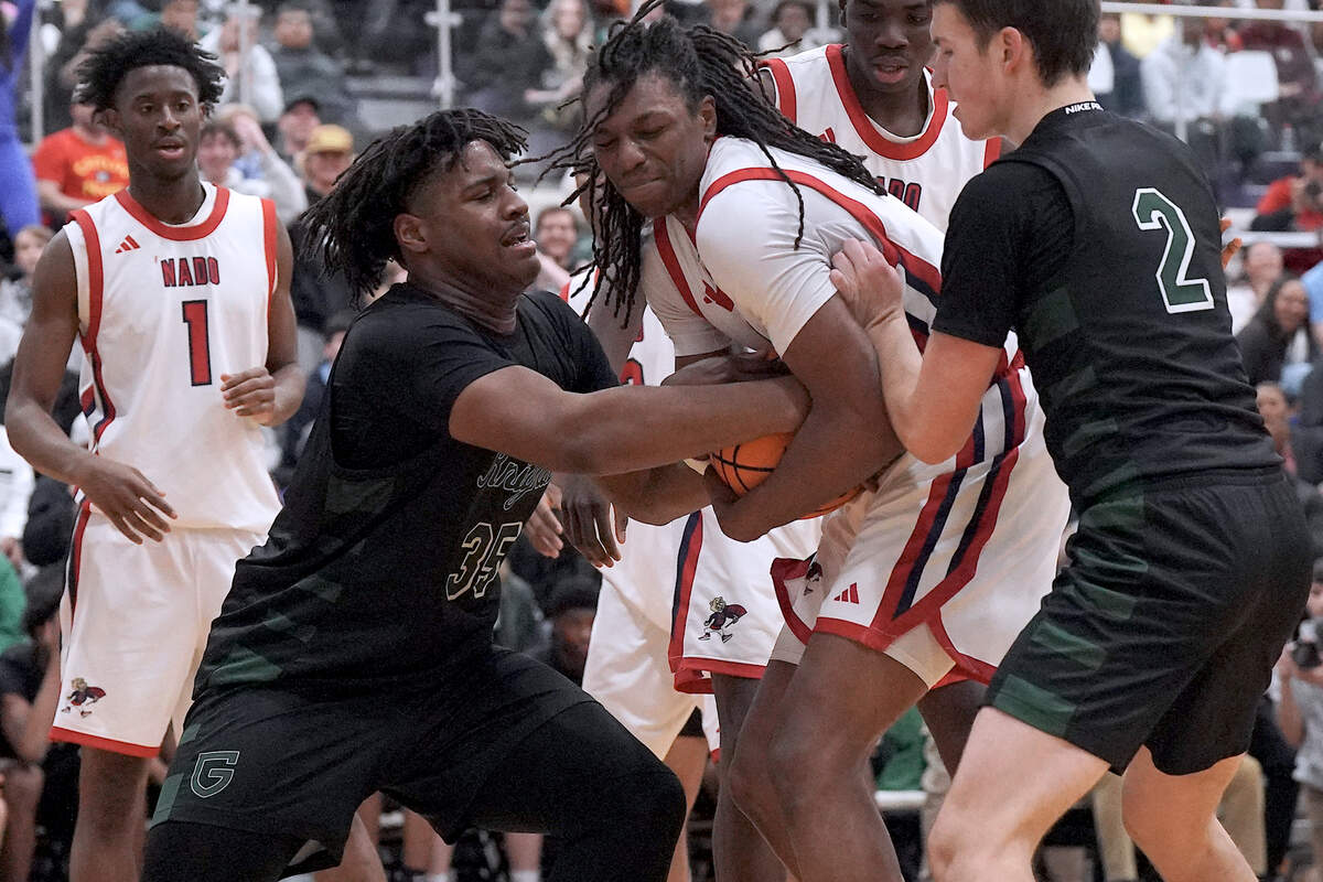 Greenfield's Braxten Dubose (35) battles with Coronado's  Amare Oba (4) for possession of the ball during the second half.  The Greenfield Knights and the Coronado Cougars (Nevada) met in the finals of the Day'Ron Sharpe bracket of the  John Wall Holiday Tournament in Raleigh, N.C. on December 30, 2025.