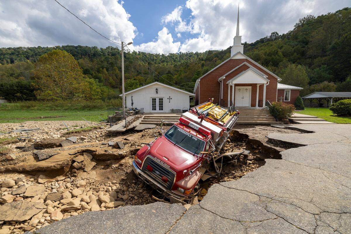 A Pensacola Fire Department truck, photographed on Thursday, October 3, 2024, truck fell victim to flood waters from Hurricane Helen that flooded the nearby Cane River. Firefighters stationed the truck at this end of the community, dividing their resources, to better serve the community in case the main fire station became inaccessible.
