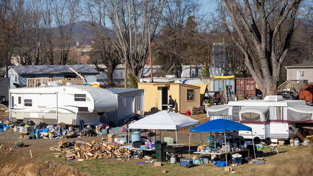 A variety of housing options are shown along the Swannanoa River, in Swannanoa,  N.C. on Friday, December 20, 2024. This area was heavily damaged by flooding from Hurricane Helene. Some residents are living in travel trailers, while temporary housing units are built.  