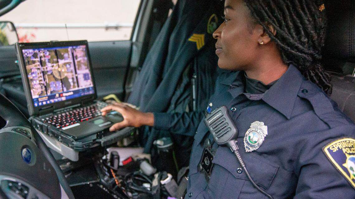 During a Nov. 24, 2021 demonstration in Springfield, Ill, Springfield Police Officer Timara Pflug shows how officers can use computers in their squad cars to see a notification of gunfire on a map using the ShotSpotter system.