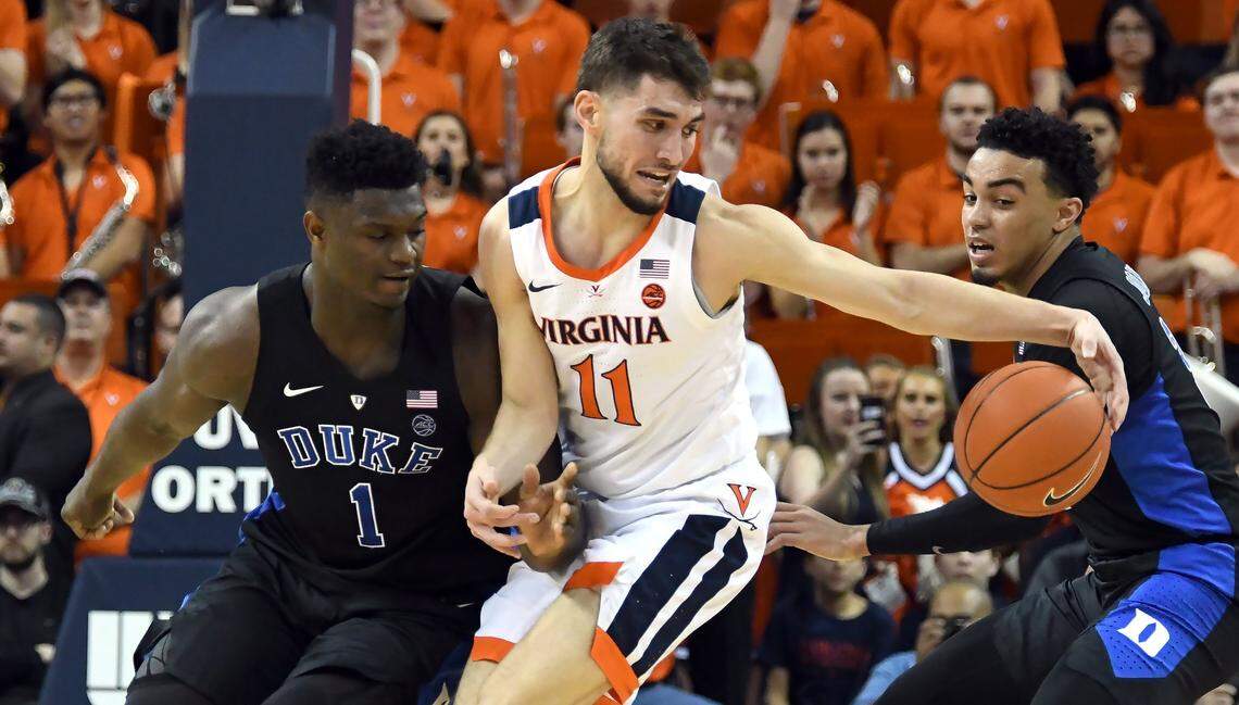Duke forward Zion Williamson (1) and guard Tre Jones (3) pressure Virginia guard Ty Jerome (11) at John Paul Jones Arena in Charlottesville, Va., Saturday, Feb. 9,2019.