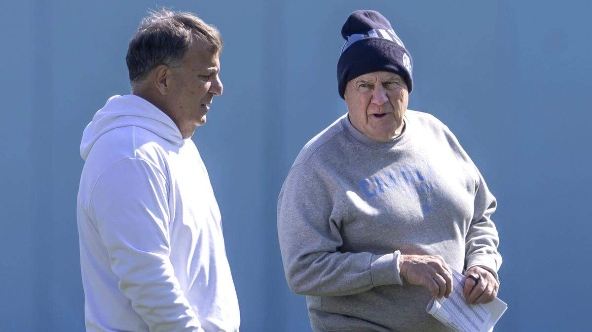 North Carolina coach Bill Belichick talks with general manager Michael Lombardi, during the Tar Heels’ spring practice, on Tuesday, March 24, 2026, at Kenan Stadium Chapel Hill, N.C.