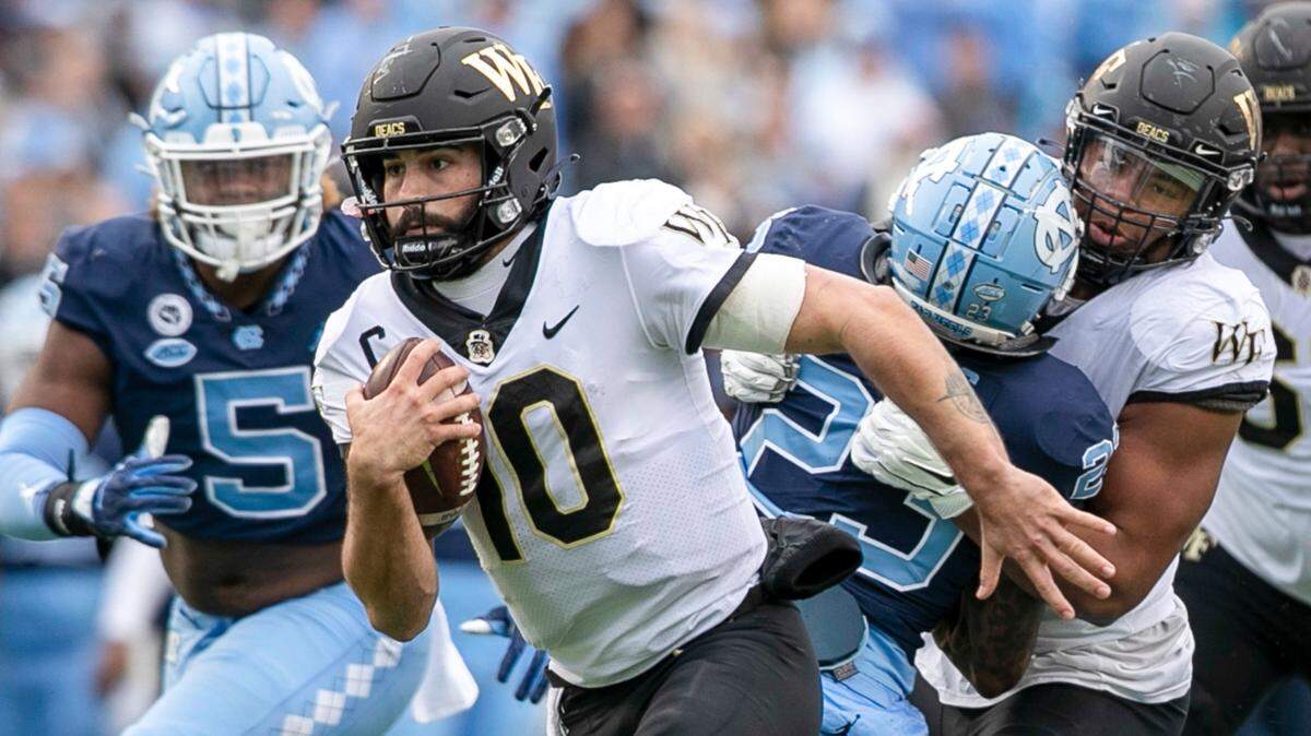 Wake Forest quarterback Sam Hartman (10) scores on a 21-yard run in the third quarter to give Wake a 38-27 lead against North Carolina on Saturday, November 6, 2021 at Kenan Stadium in Chapel Hill, N.C.