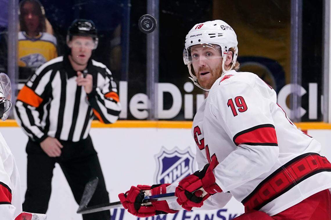 Carolina Hurricanes defenseman Dougie Hamilton (19) follows the bouncing puck in the second period of an NHL hockey game against the Nashville Predators Tuesday, March 2, 2021, in Nashville, Tenn. (AP Photo/Mark Humphrey)