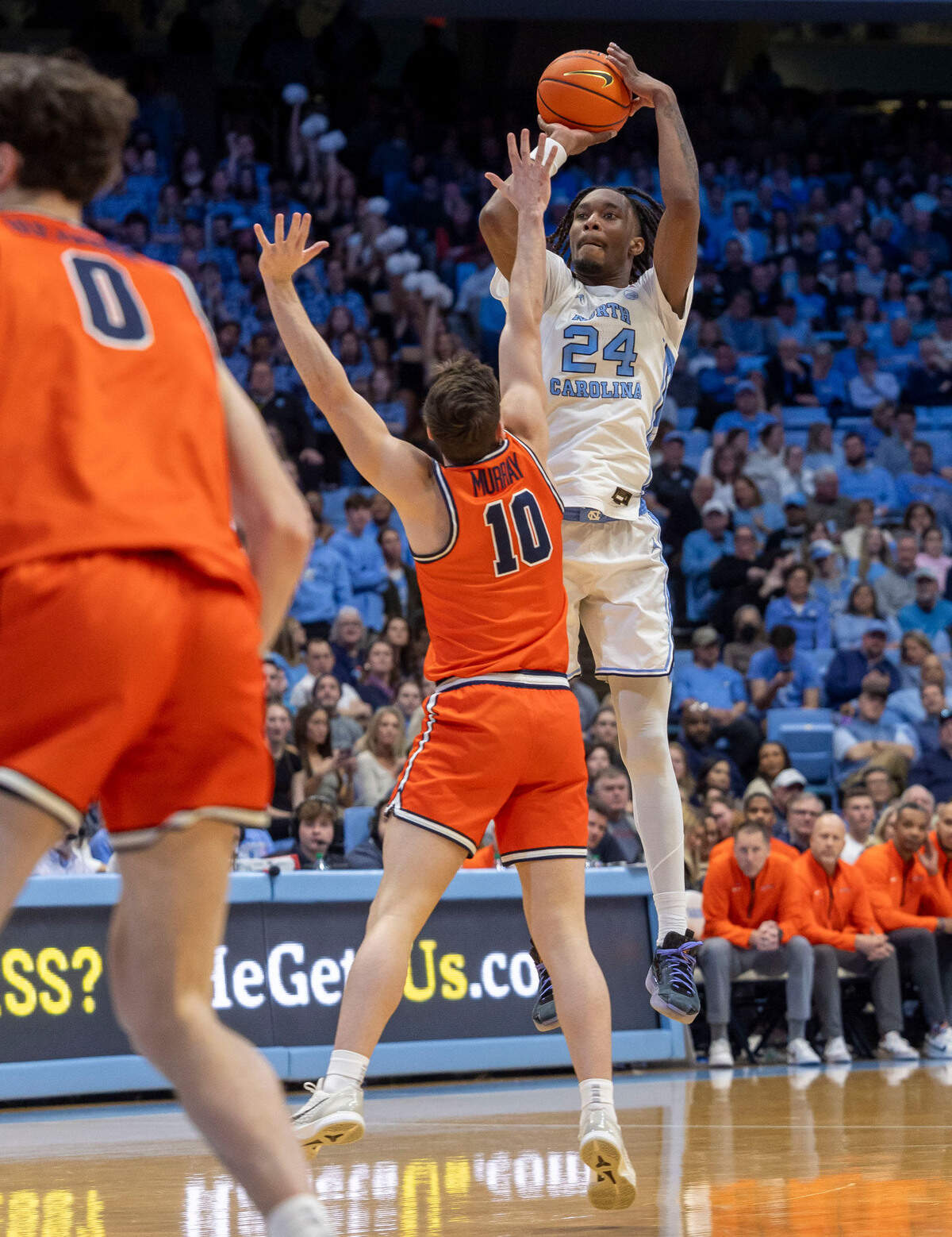 North Carolina forward Jae’Lyn Withers (24) launches a three-point shot over Virginia guard Taine Murray (10) in the second half on Saturday, February 22, 2025 at the Smith Center in Chapel Hill, N.C. Withers scored 16 points in the Tar Heels’ 81-66 victory.