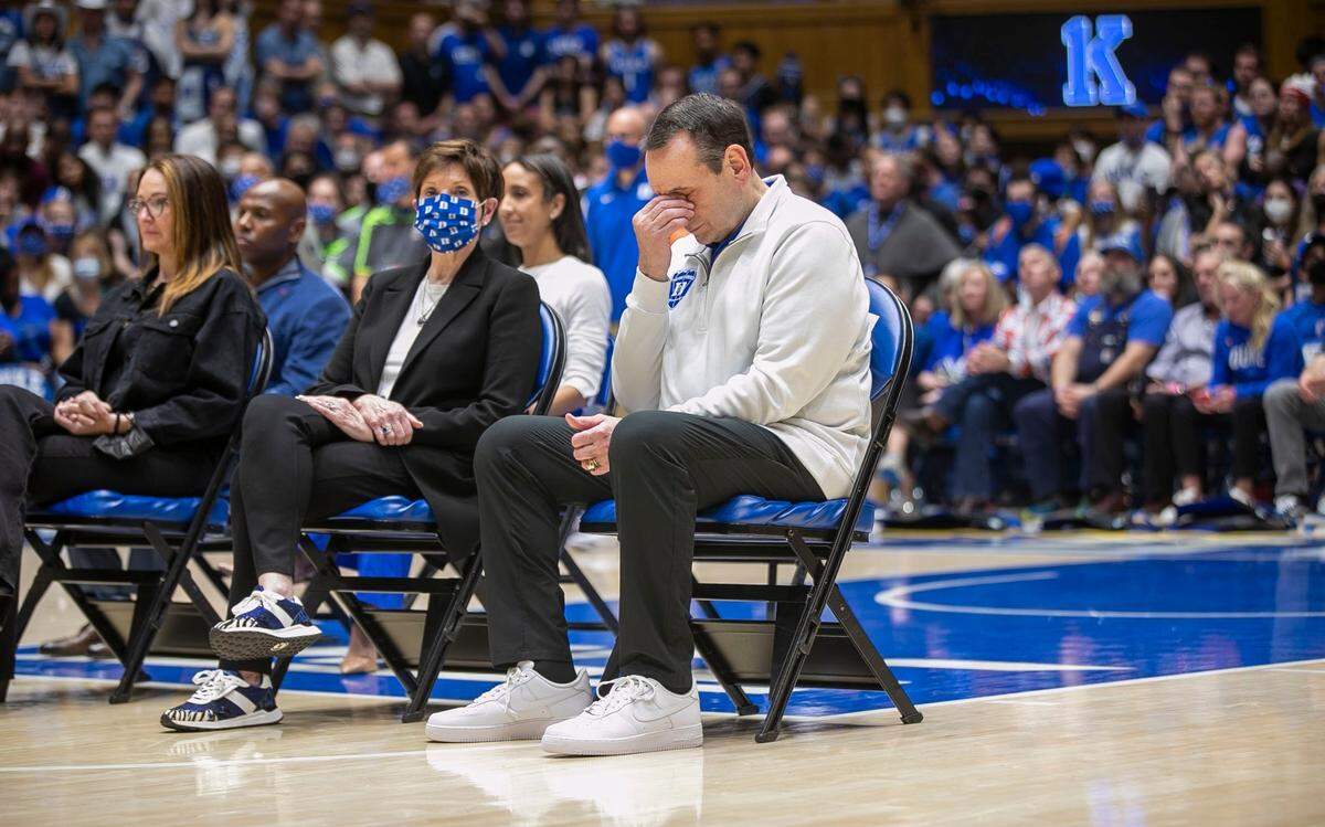Duke coach Mike Kerzyzewski reacts as he his recognized by Dukes president Vincent Price with five scholarship in the Krzyzewski name following the Blue Devils 94-81 loss to North Carolina on Saturday, March 5, 2022 in Durham, N.C.