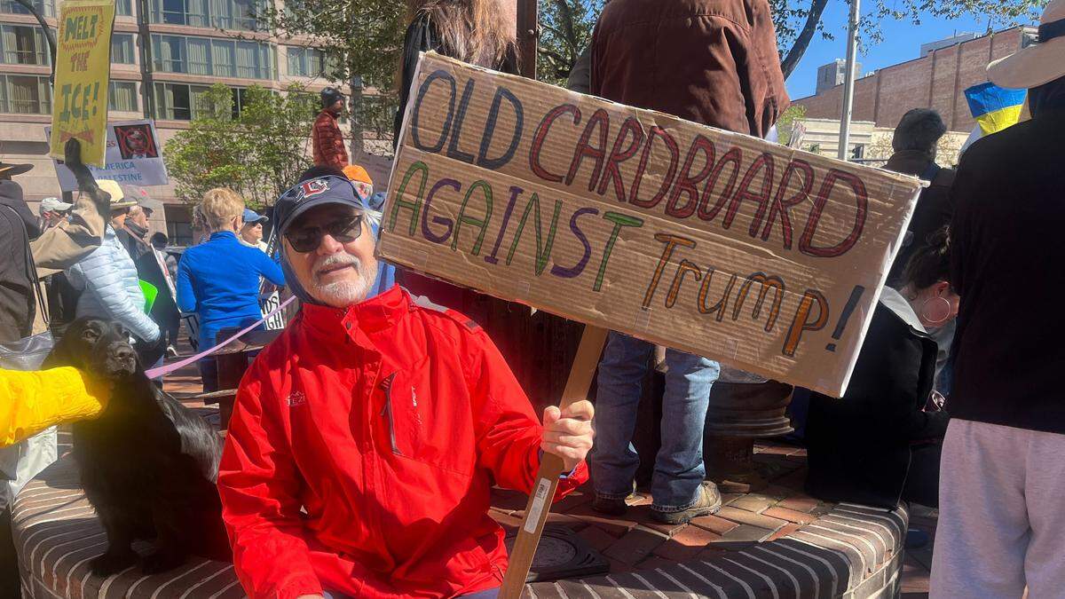 Bob Kliesen displays his “Old Carboard Against Trump!” sign at the No Kings protest in Durham, N.C., Saturday, March 28, 2026.