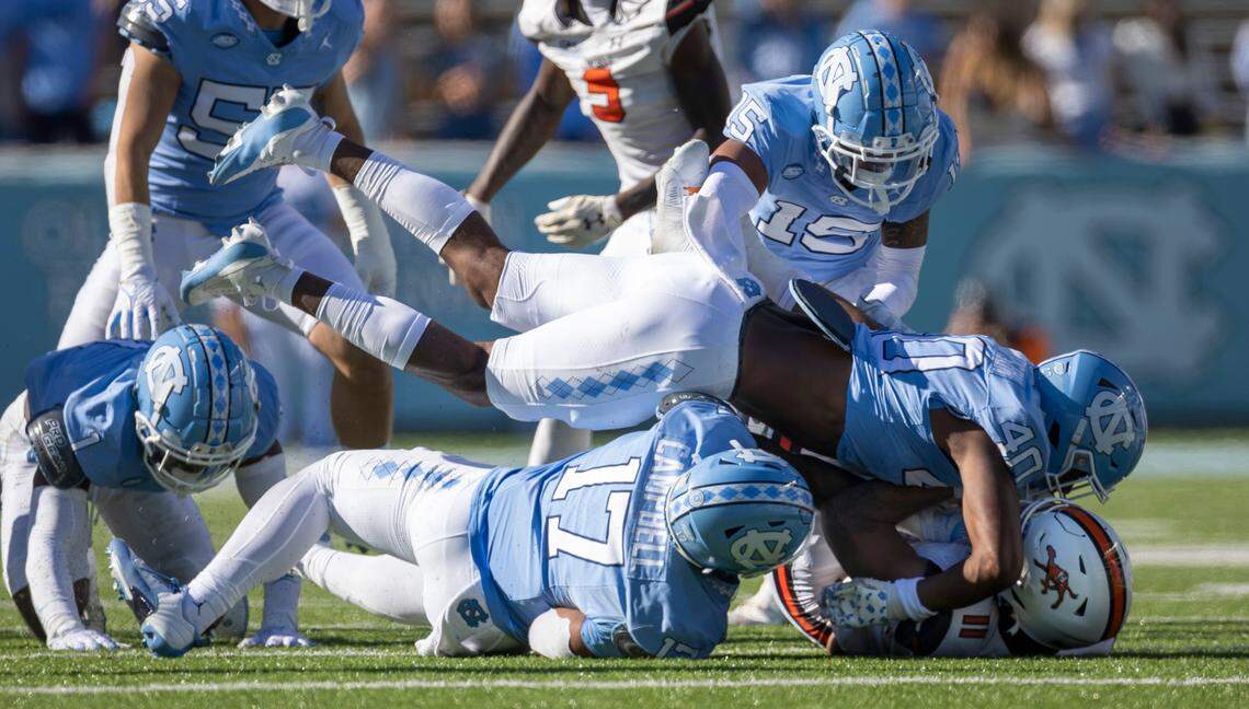 North Carolina’s Tyler Thompson (40) stops Campbells’ Chris McKay Jr. (11) for a one-yard loss in the fourth quarter on Saturday, November 4. 2023 at Kenan Stadium in Chapel Hill, N.C.