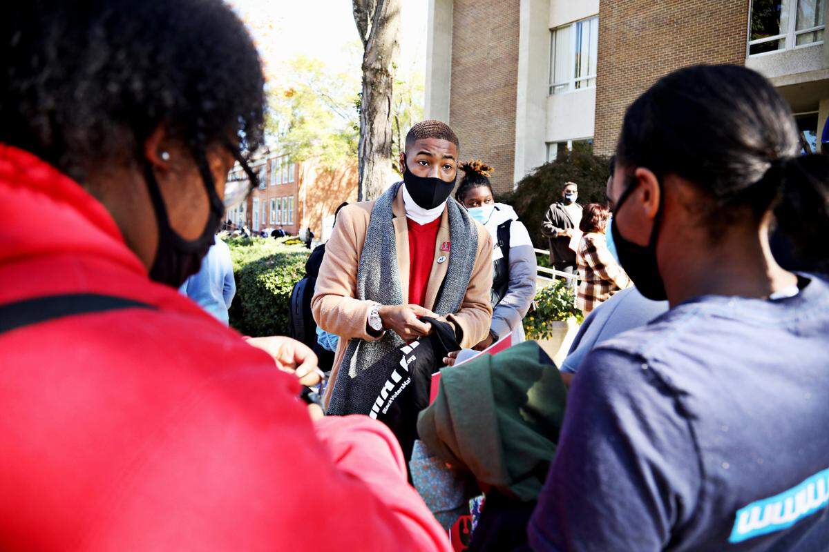 Saint Augustine’s University students gather on campus Tuesday, Nov. 3, 2020, to march to the polls at Tarboro Road Community Center in Raleigh.