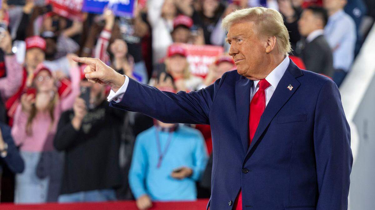 Republican presidential nominee and former President Donald Trump takes the stage during a rally at Dorton Arena in Raleigh on Monday, Nov. 4, 2024, one day before Election Day.