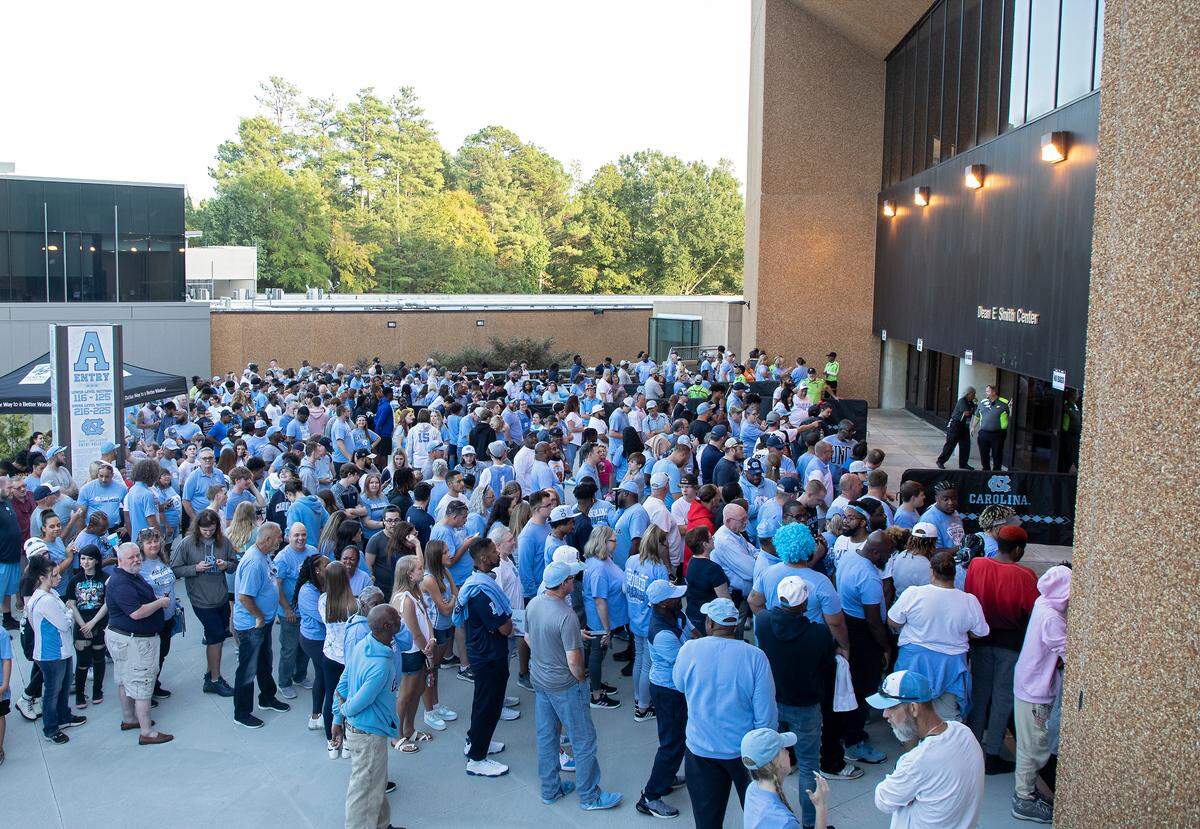 Crowds wait to be admitted to the Dean E. Smith Center prior to “Live Action with Carolina Basketball” on Friday, Oct. 7, 2022, in Chapel Hill, N.C.